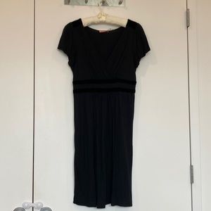 Black v-neck dress with velvet details.